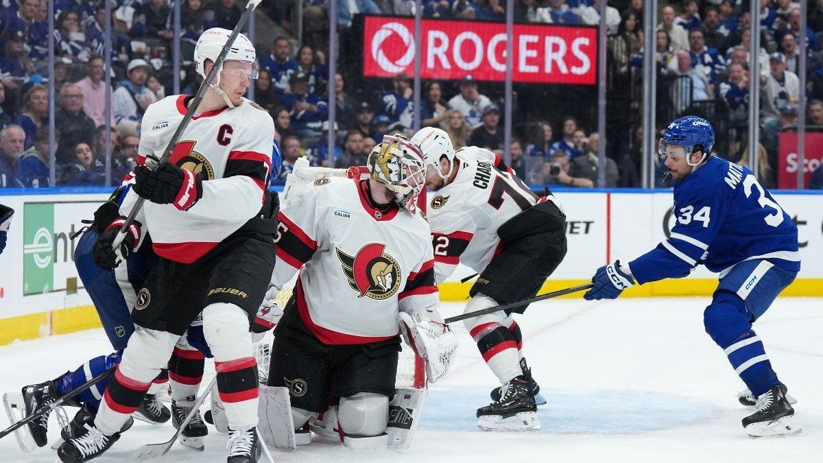 Toronto Maple Leafs center Auston Matthews (34) battles with Ottawa Senators defenseman Thomas Chabot (72) at Scotiabank Arena in Toronto, Ontario, on April 29, 2025.