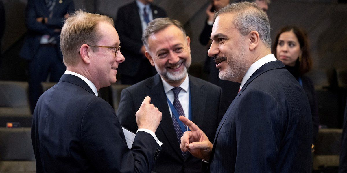 Turkish Foreign Minister Hakan Fidan speaks with Swedish Foreign Minister Tobias Billstrom ahead of the NATO Foreign Ministers meeting at NATO Headquarters in Brussels, Belgium, November 28, 2023. 