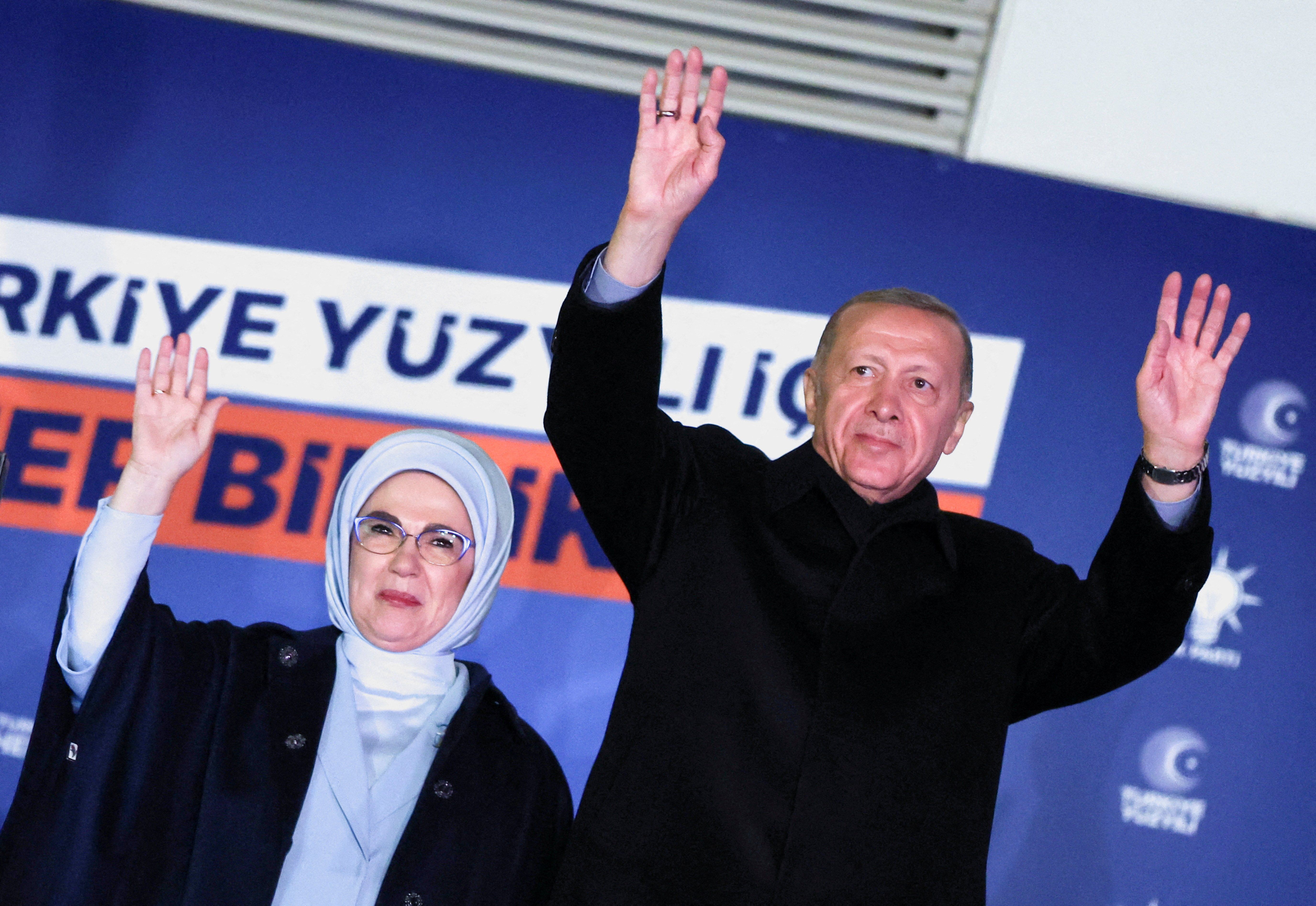 Turkish President Tayyip Erdogan, accompanied by his wife Ermine Erdogan, greets supporters at the AK Party headquarters in Ankara, Turkey.
