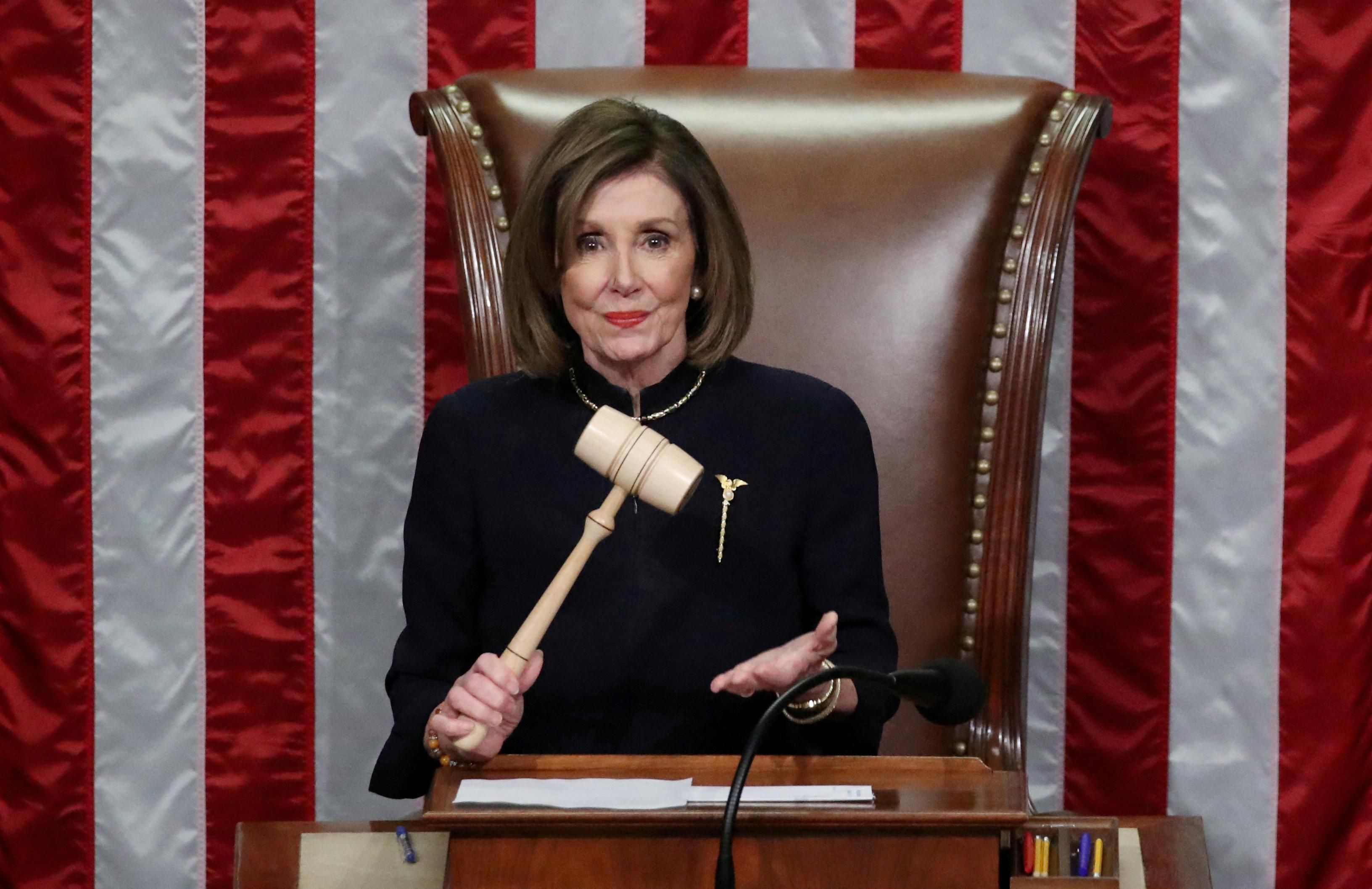 US House Speaker Nancy Pelosi (D-CA) wields the gavel as she presides over the first impeachment of President Donald Trump.