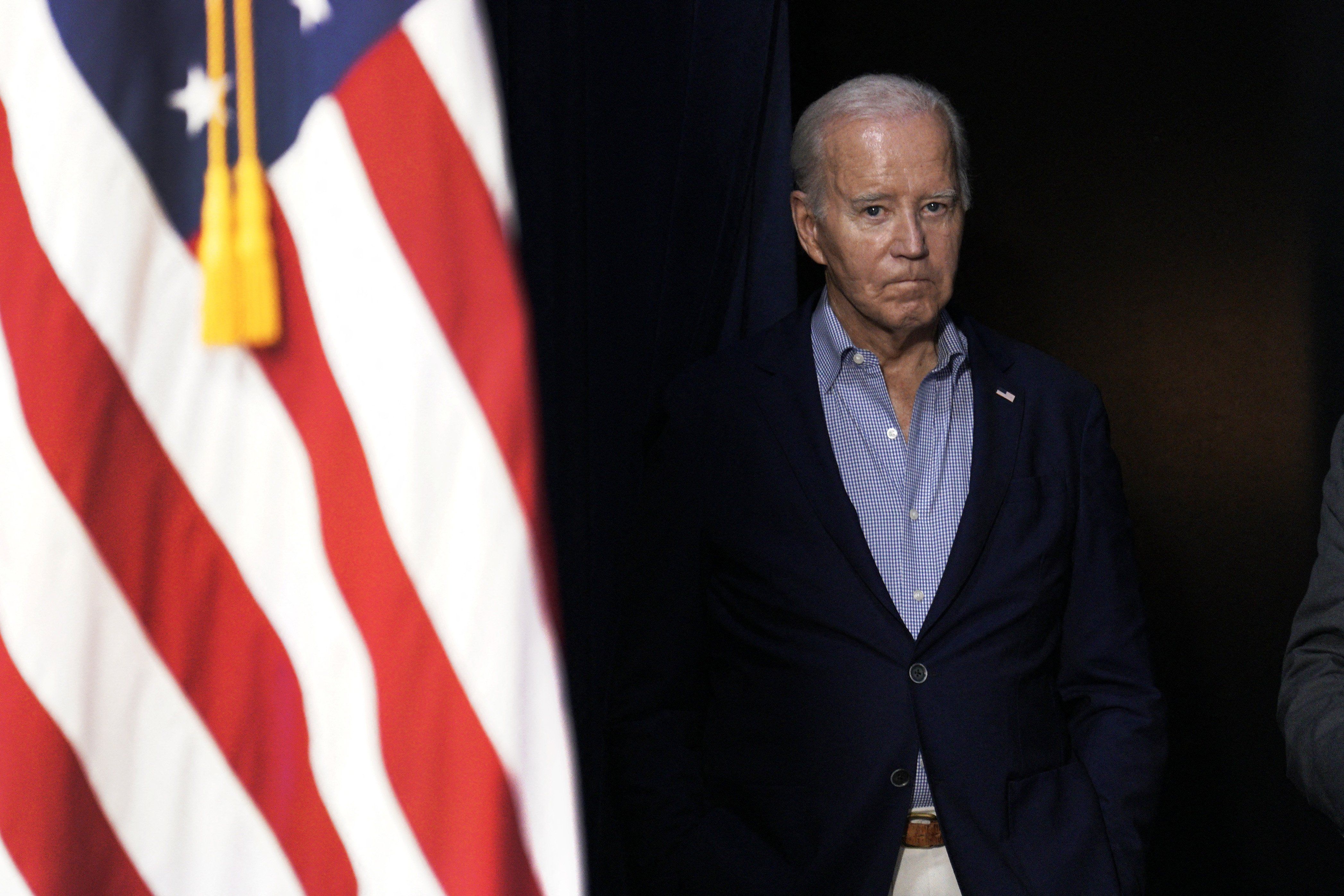 US President Joe Biden and an American flag