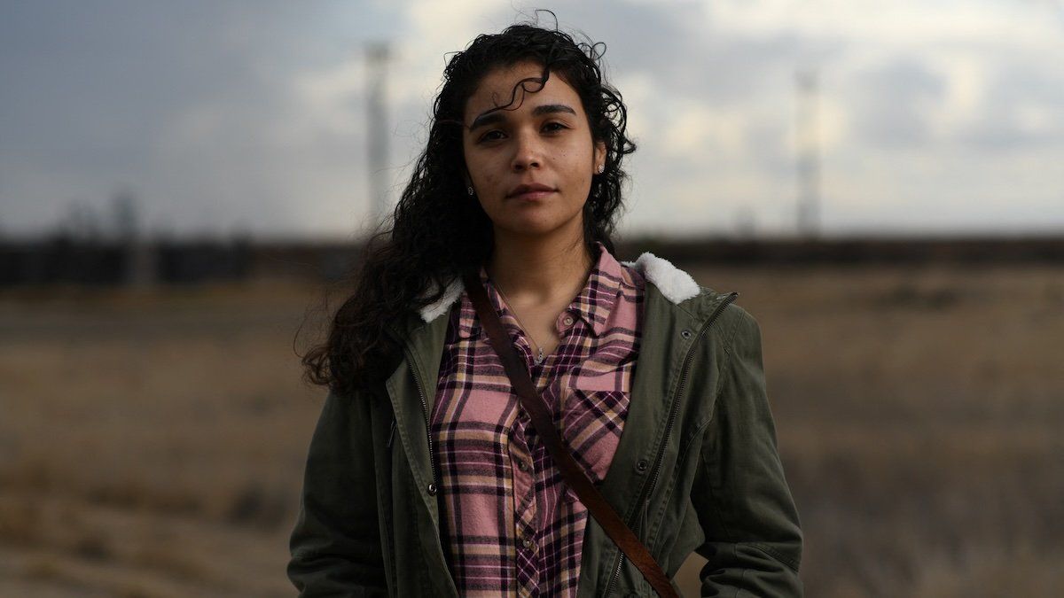 Valeria Murguia, 21, a university student, poses for a photograph in a field near her home in McFarland, California, U.S., December 17, 2020.