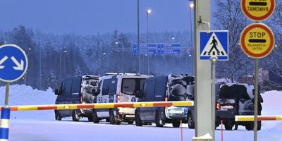 Vehicles of Finnish police are seen parked at the re-opened Vaalimaa border checkpoint between Finland and Russia in Virolahti, Finland, on Dec. 14, 2023. 