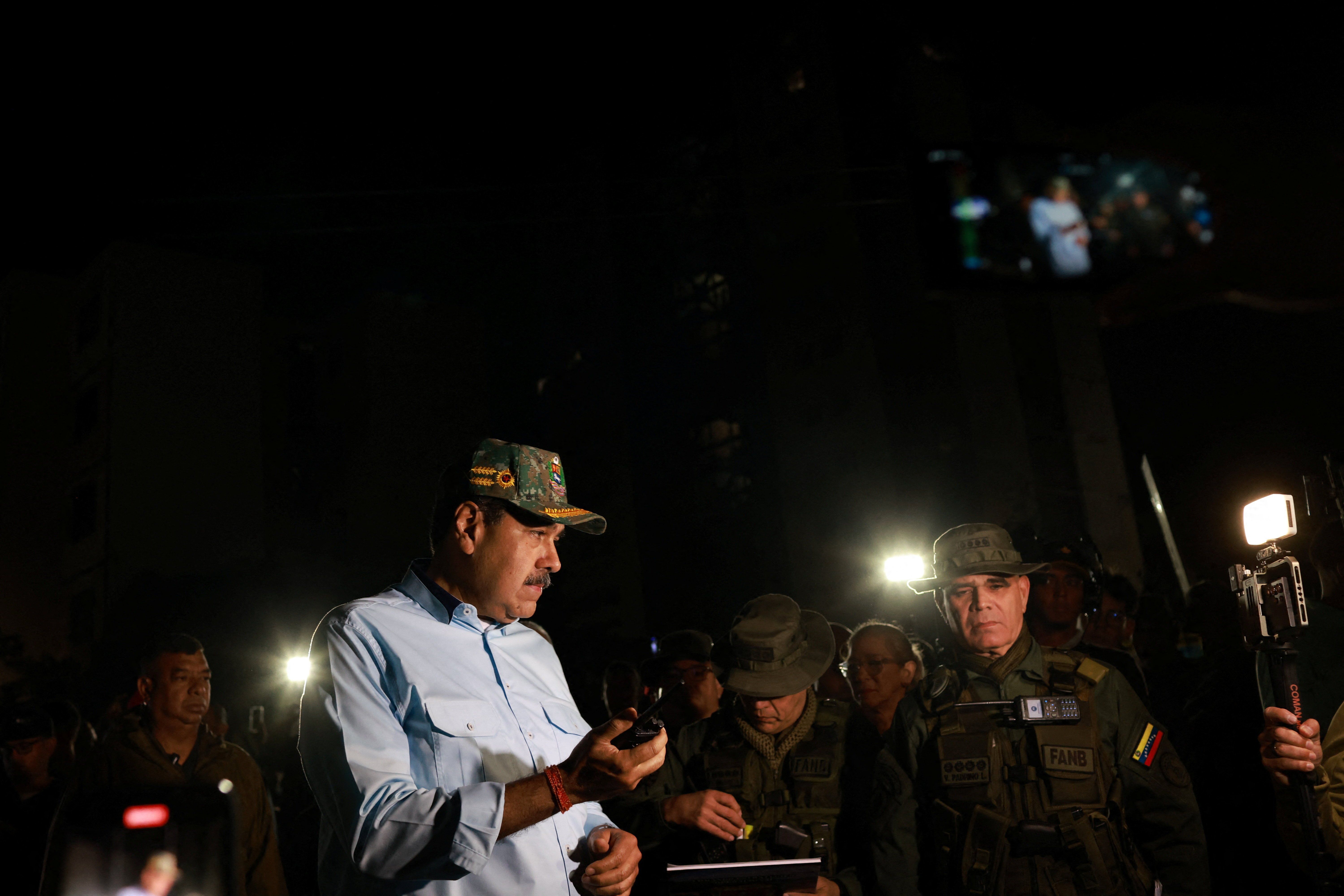 ​Venezuela's President Nicolas Maduro stands next to members of the armed forces, on the day he says that his country would deploy military, police and civilian defenses at 284 "battlefront" locations across the country, amid heightened tensions with the U.S., in La Guaira, Venezuela, September 11, 2025. 