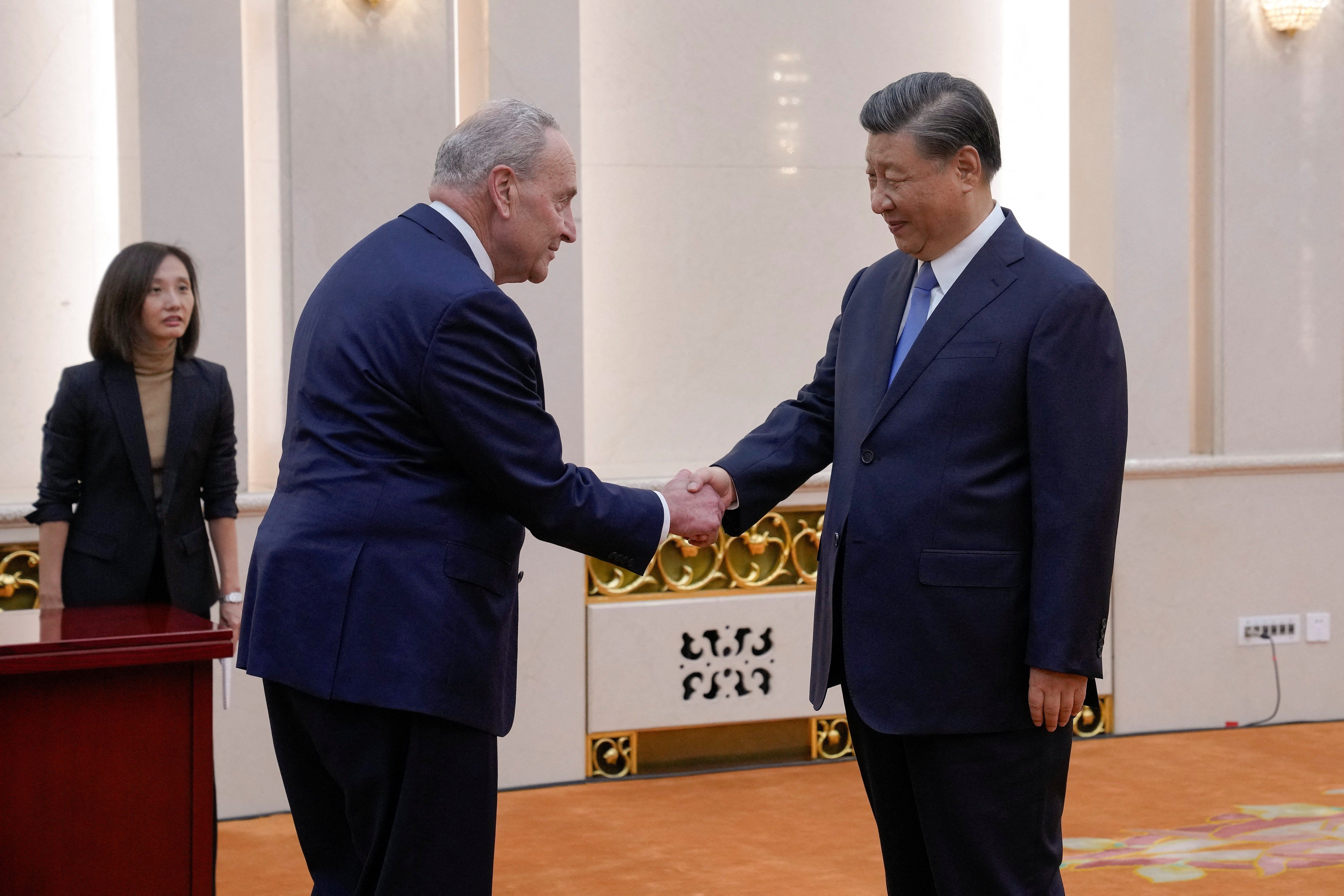 Visiting U.S. Senate Majority Leader Chuck Schumer, D-N.Y., is greeted by Chinese President Xi Jinping before their bilateral meeting at the Great Hall of the People in Beijing, Monday, Oct. 9, 2023.