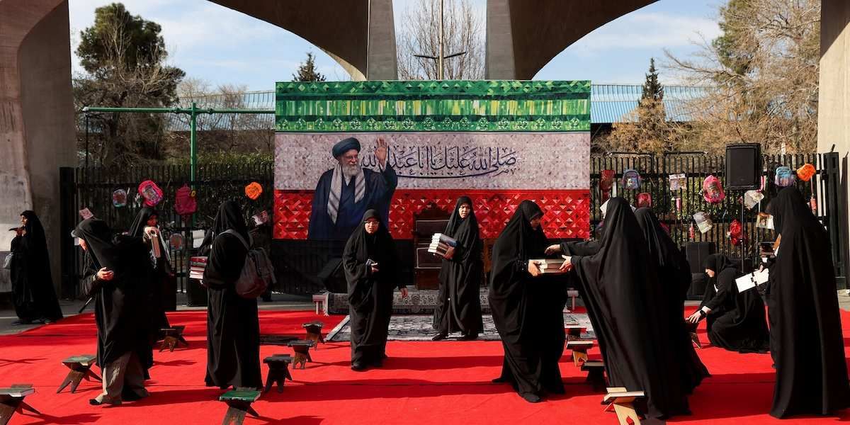 ​Women prepare a makeshift memorial in tribute to Iran's late Supreme Leader Ayatollah Ali Khamenei on a street, after he was killed in Israeli and U.S. strikes on Saturday, amid the U.S.-Israeli conflict with Iran, in Tehran, Iran, March 4, 2026. 