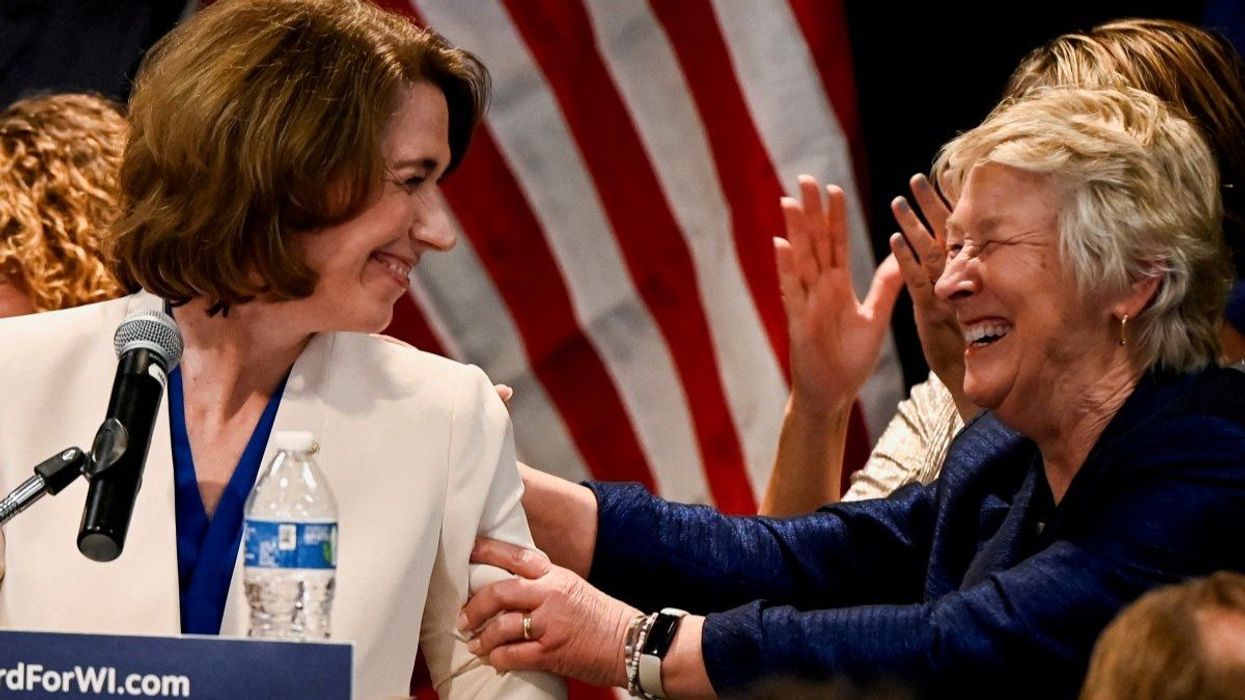 Liberal candidate Judge Susan Crawford celebrates with Wisconsin Supreme Court Judge Ann Walsh Bradley at her election night headquarters in Madison, Wisconsin, on April 1, 2025.