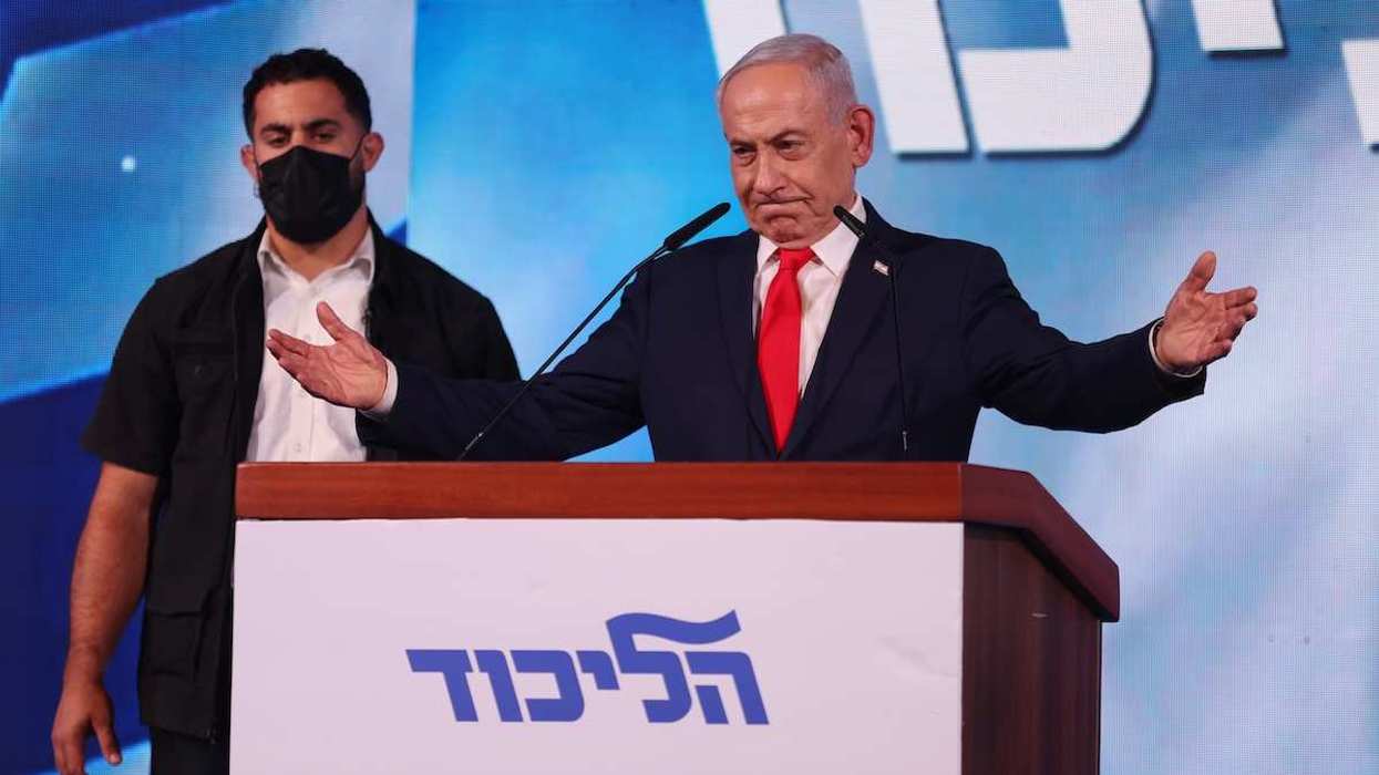 Likud Party leader and Israeli Prime Minister Benjamin Netanyahu delivers a speech to supporters at the Likud campaign headquarters following the release of exit polls and initial results of the general election in Jerusalem on October 28, 2026.