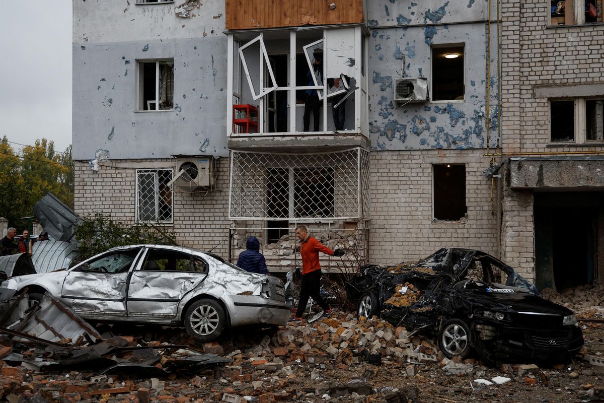 Local residents at a site of a residential building damaged by a Russian missile attack in Mykolaiv, Ukraine. 