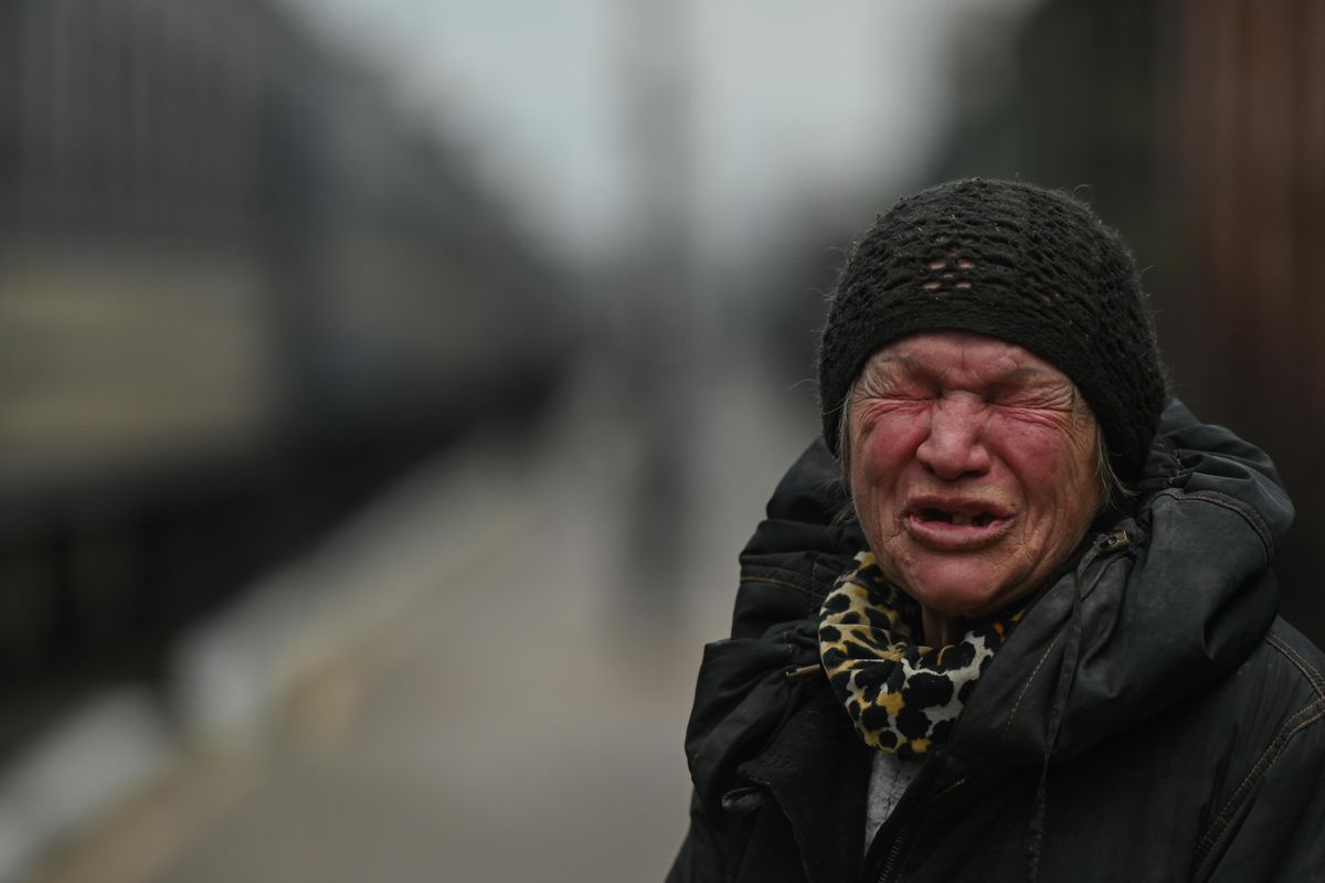 Local woman cries as she prepares to enter an evacuation train from Kherson, Ukraine. 