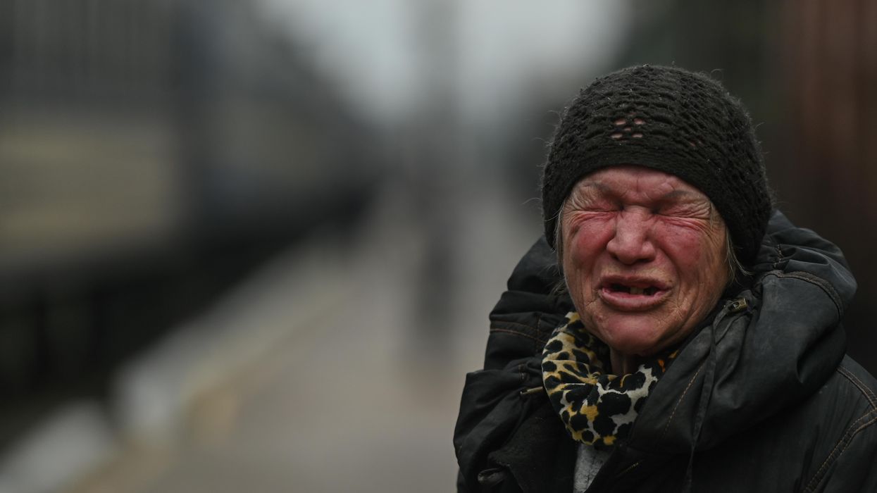 Local woman cries as she prepares to enter an evacuation train from Kherson, Ukraine.
