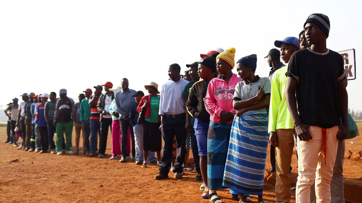 Locals wait to cast their votes during the Zimbabwe general elections in Kwekwe, outside Harare, Zimbabwe.