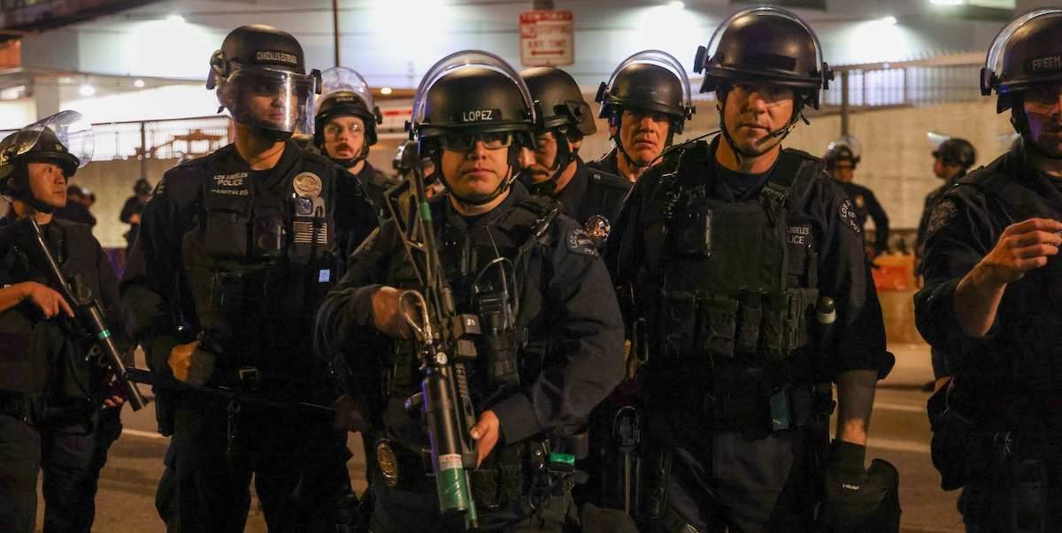​Los Angeles Police Department (LAPD) stands in formation in a show of force and response after ICE agents tear gassed, shot less lethal weapons and chased a mostly peaceful group of about 150 protestors who were upset with the recent killings of protestors in Minneapolis and the increased activity in their LA neighborhoods. 