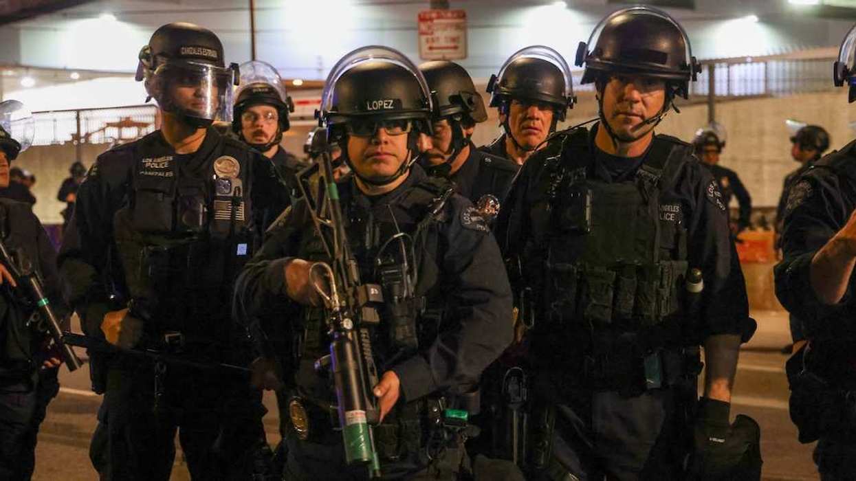 Los Angeles Police Department (LAPD) stands in formation in a show of force and response after ICE agents tear gassed, shot less lethal weapons and chased a mostly peaceful group of about 150 protestors who were upset with the recent killings of protestors in Minneapolis and the increased activity in their LA neighborhoods.