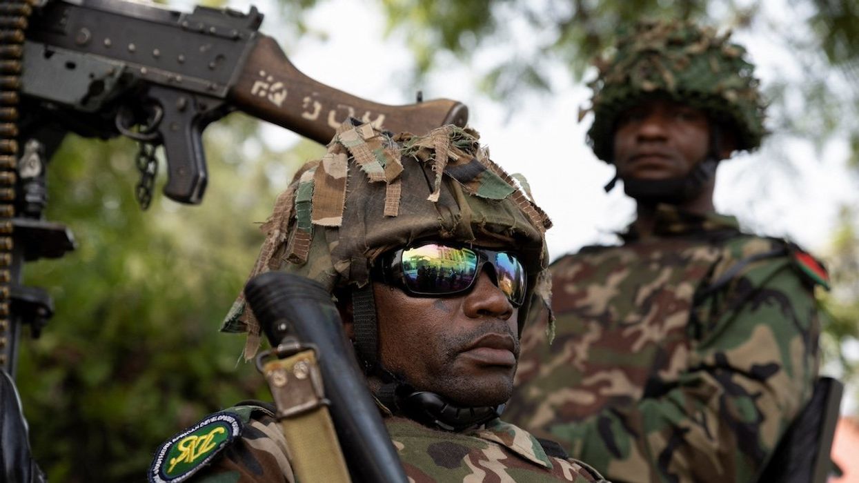 Malawi soldiers part of the Southern African Development Community (SADC) military mission for eastern Congo, wait for the ceremony to repatriate the two bodies of South African soldiers killed in the ongoing war between M23 rebels and the Congolese army in Goma, North Kivu province of the Democratic Republic of Congo February 20, 2024.