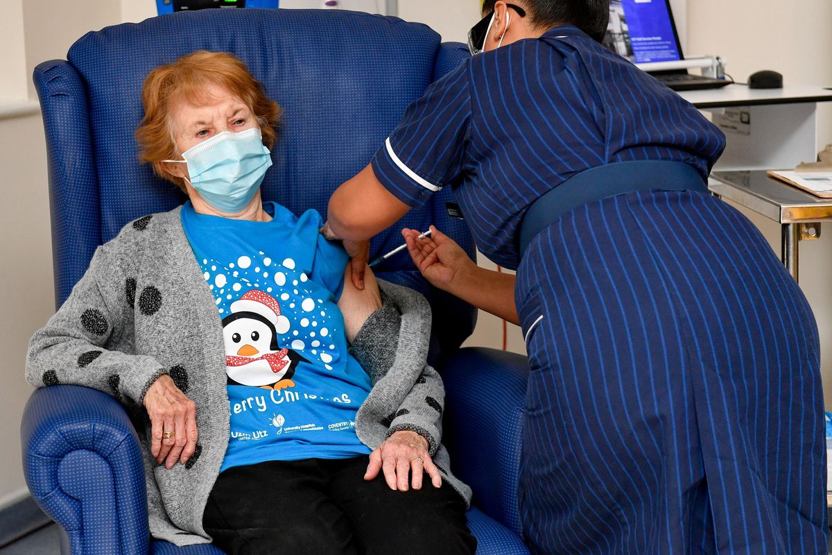 Margaret Keenan, 90, is the first patient in Britain to receive the Pfizer/BioNtech COVID-19 vaccine at University Hospital, administered by nurse May Parsons, at the start of the largest ever immunization program in British history, in Coventry. 