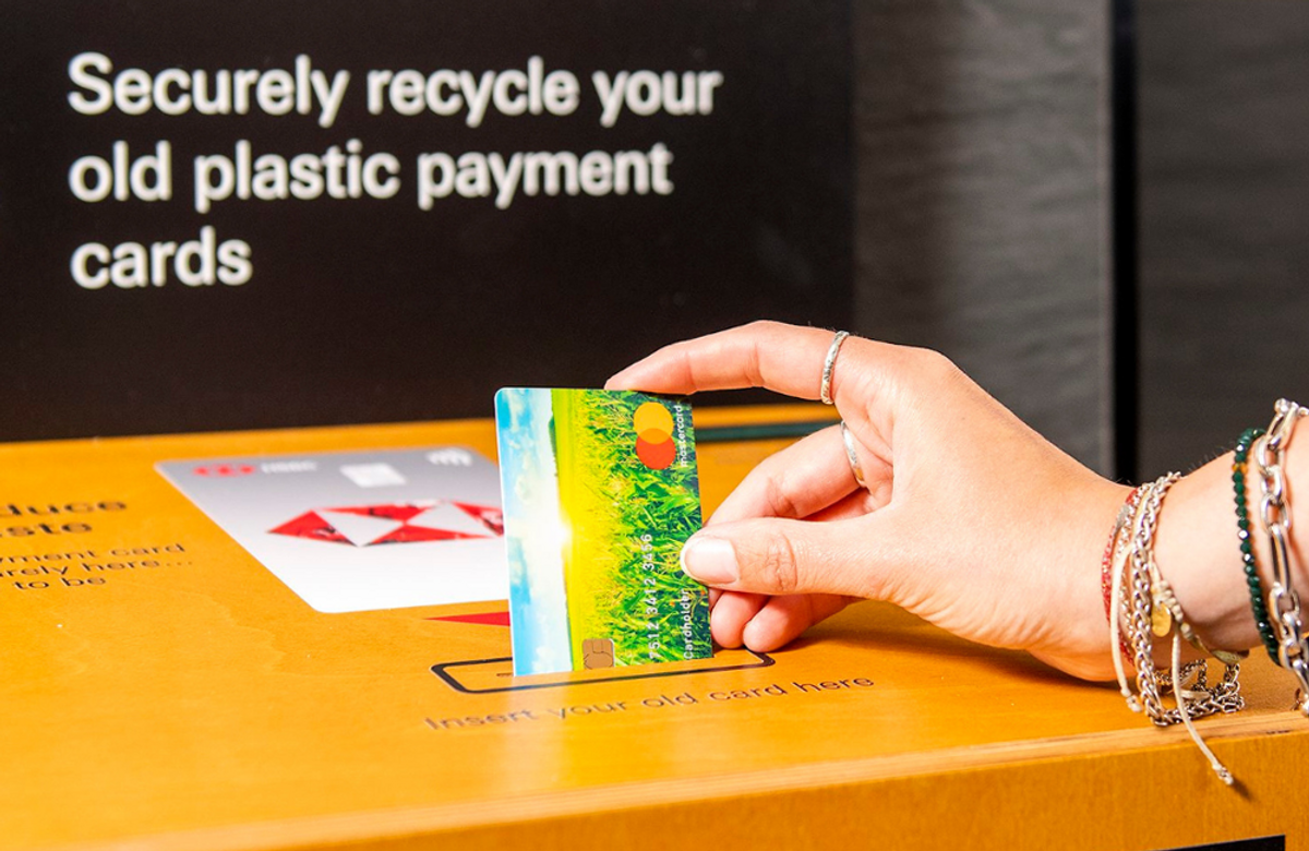Mastercard being dropped of at a recycling bin