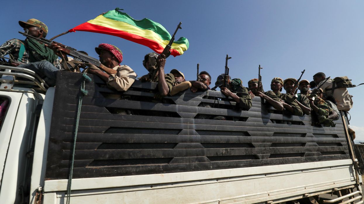 Members of Amhara region militias ride on their truck as they head to face the Tigray People's Liberation Front (TPLF), in Sanja, Amhara region near a border with Tigray, Ethiopia November 9, 2020