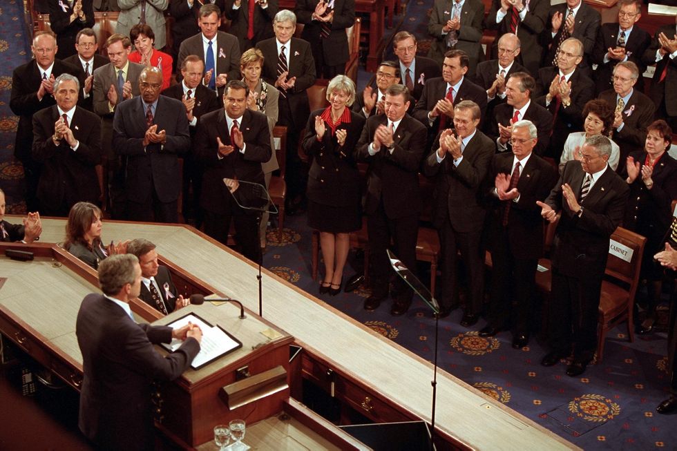   Members of Congress applaud President George W. Bush on Sept. 20, 2001 during joint session of Congress to address the 9/11 attacks. 