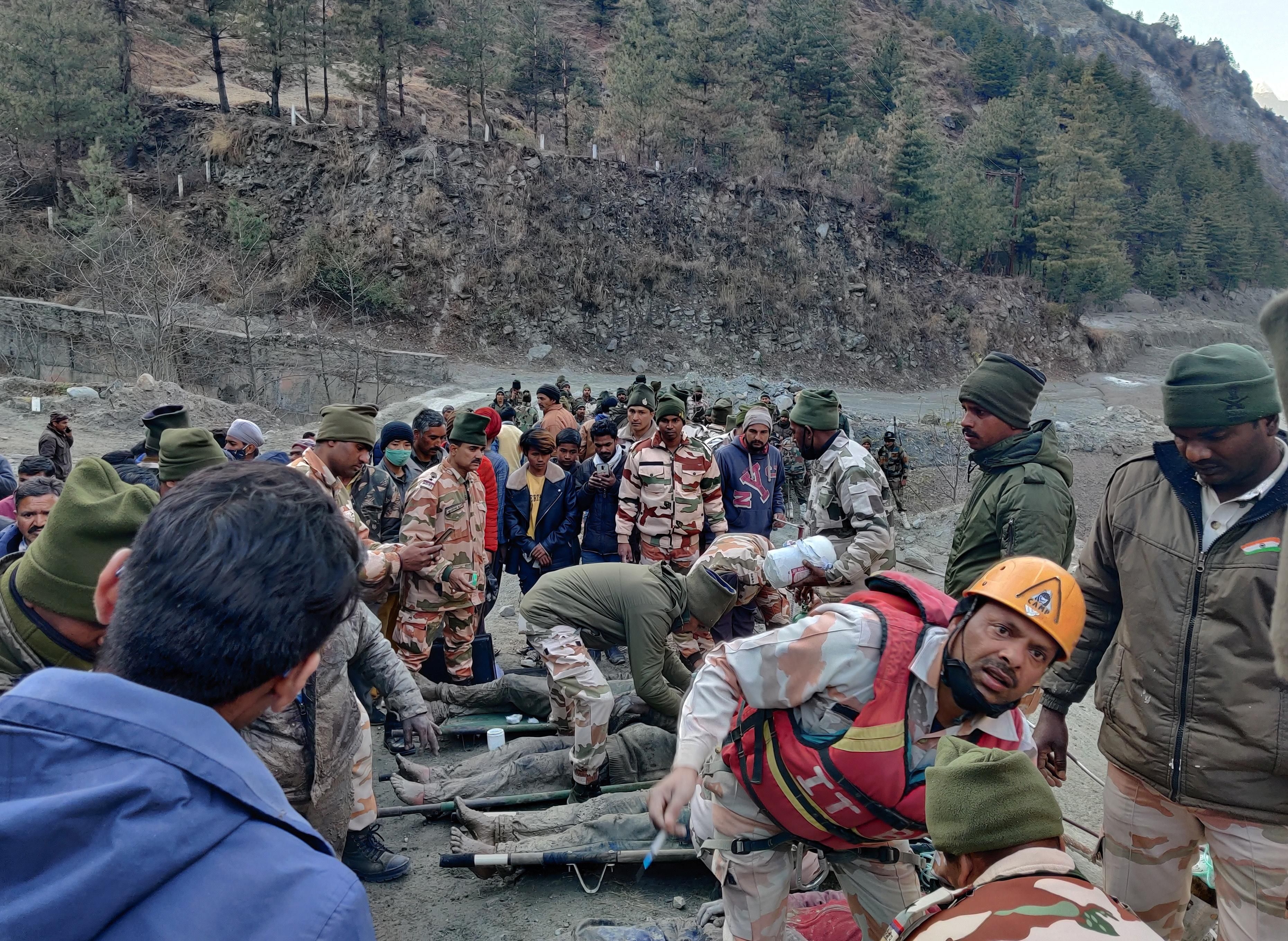 Members of Indo-Tibetan Border Police (ITBP) tend to people rescued after a Himalayan glacier broke and swept away a small hydroelectric dam, in Chormi village in Tapovan in the northern state of Uttarakhand, India, February 7, 2021.