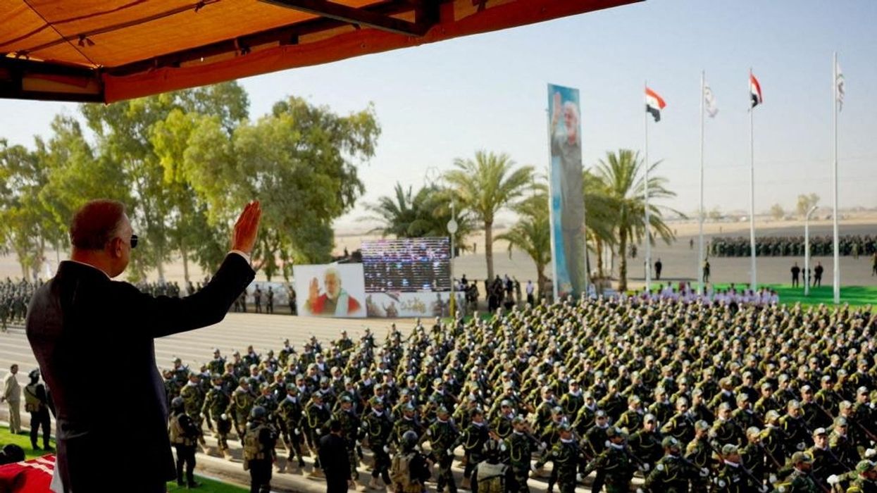 Members of Iraqi Popular Mobilization Forces (PMF) marking its eighth anniversary, in Diyala province, Iraq.