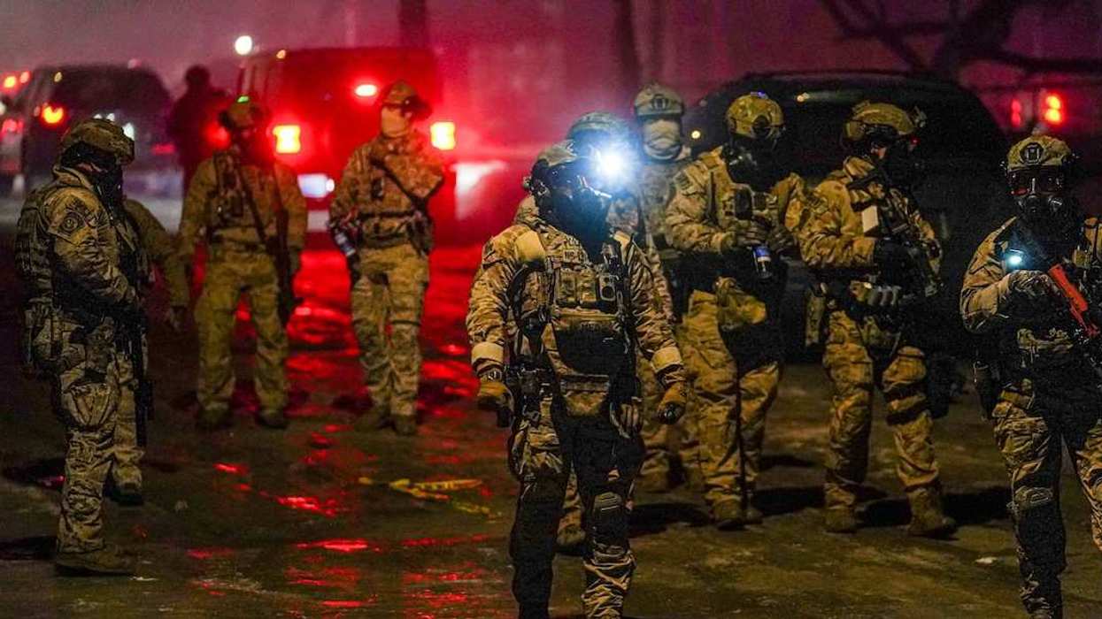 Members of law enforcement gather, as tensions rise after federal law enforcement agents were involved in a shooting incident, a week after a U.S. Immigration and Customs Enforcement (ICE) agent fatally shot Renee Nicole Good, in north Minneapolis, Minnesota, U.S., January 15, 2026.