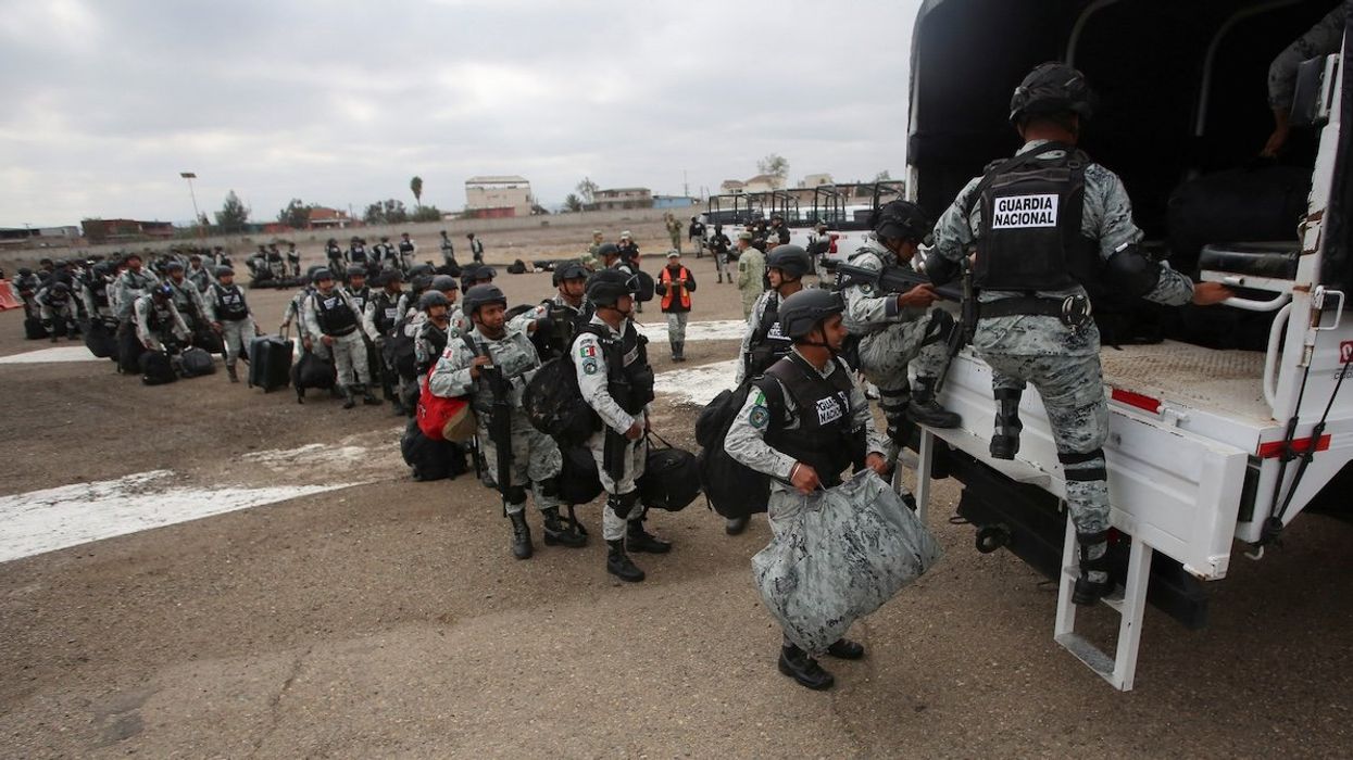 Members of Mexico's National Guard queue to board a vehicle upon disembarking from a plane, after Mexican President Claudia Sheinbaum agreed with U.S. President Donald Trump to bolster border enforcement efforts in response to Trump's demand to crack down on immigration and drug smuggling, in Tijuana, Mexico, on Feb. 4, 2025.