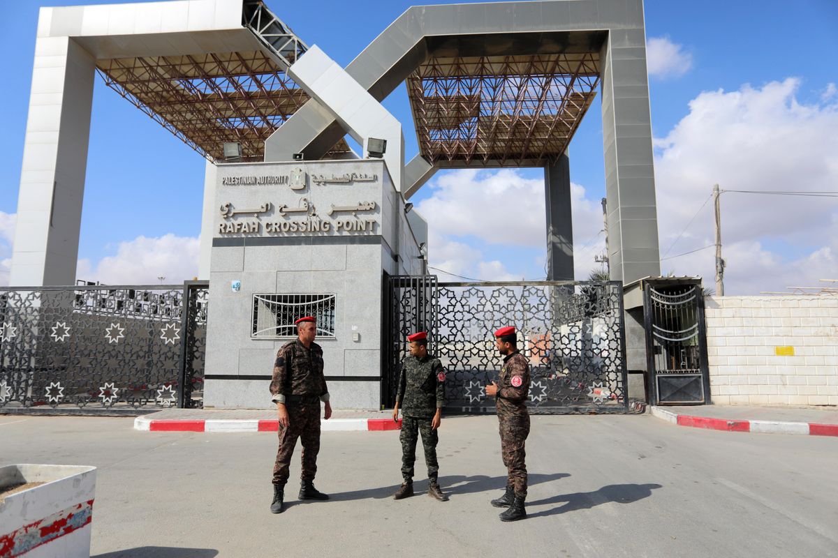 Members of Palestinan security forces stand guard at the closed off Rafah border crossing to Egypt in the southern Gaza Strip, on August 23, 2021