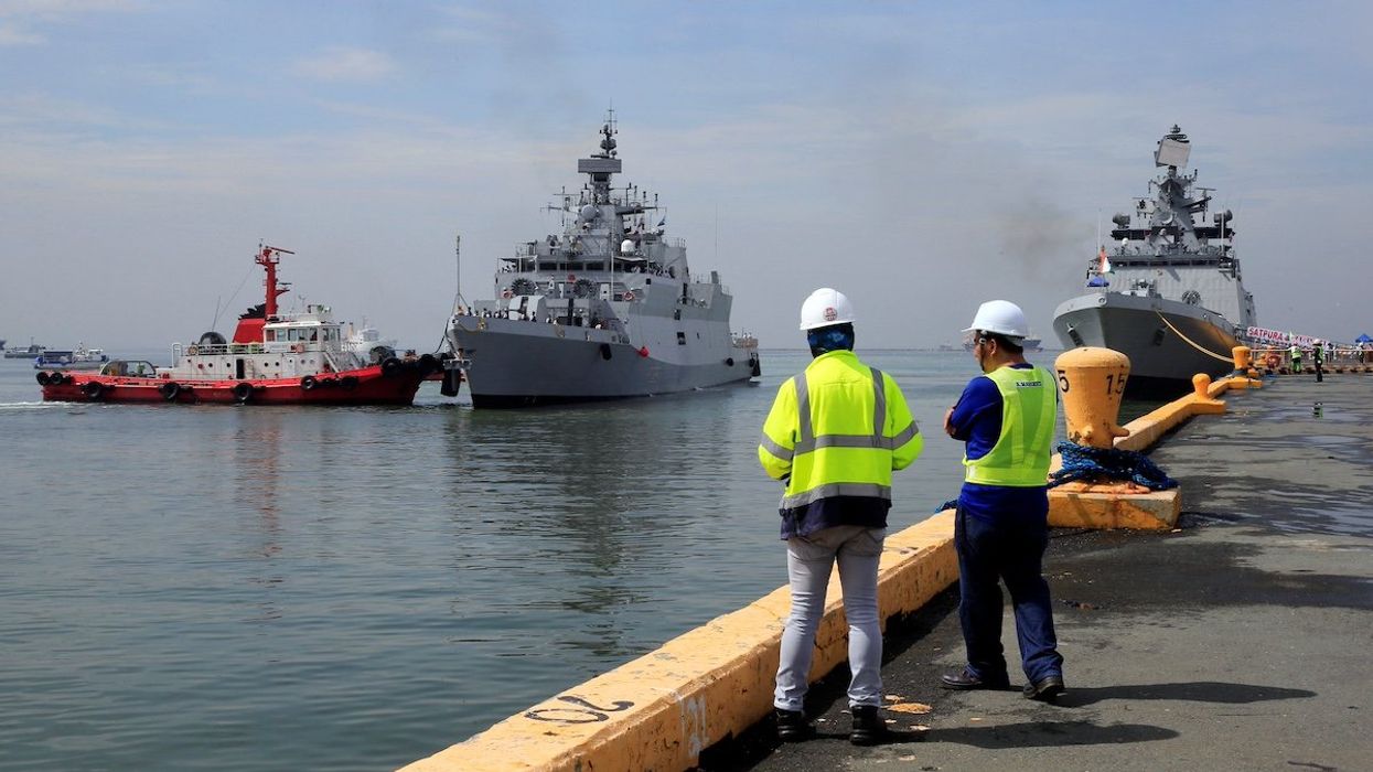 Members of the Indian Navy on board the vessel INS Kadmatt (F29) (L) and INS Satpura (F48) arrive for a four-day goodwill visit which aims to strengthen ties between India and the Philippines, at the Pier 15 in Port Are, metro Manila, Philippines October 3, 2017.