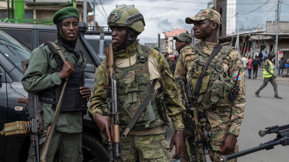 ​Members of the M23 rebel group stand guard at the opening ceremony of Caisse Generale d'epargne du Congo (CADECO) which will serve as the bank for the city of Goma where all banks have closed since the city was taken by the M23 rebels, in Goma, North Kivu province in the East of the Democratic Republic of Congo, April 7, 2025. 