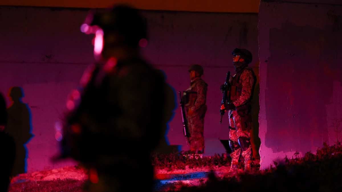 ​Members of the Mexican army stand guard at a roundabout on a main avenue in Guadalajara, Mexico, on February 23, 2026.