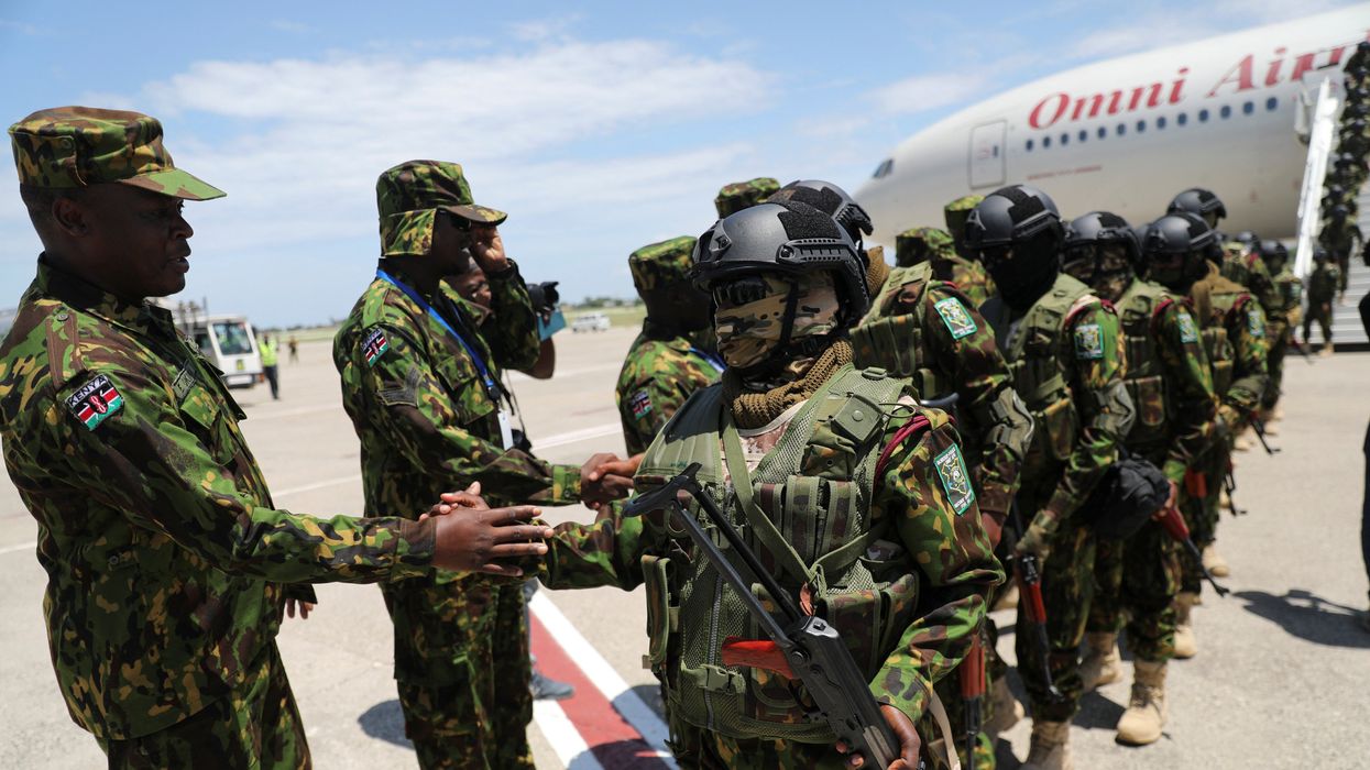 Members of the second contingent of Kenyan police greet each other after arriving in the Caribbean country as part of a peacekeeping mission, in Port-au-Prince, Haiti July 16, 2024.