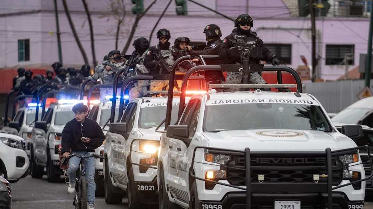 Members of the special units of the National Guard and the Secretaria de Seguridad Ciudadana stand guard in front of the Fiscalia General de la Republica, where the investigation into the operation in which Nemesio Oseguera Cervantes, alias "El Mencho", founder and leading head of the Cartel de Jalisco Nueva, was killed, is underway.