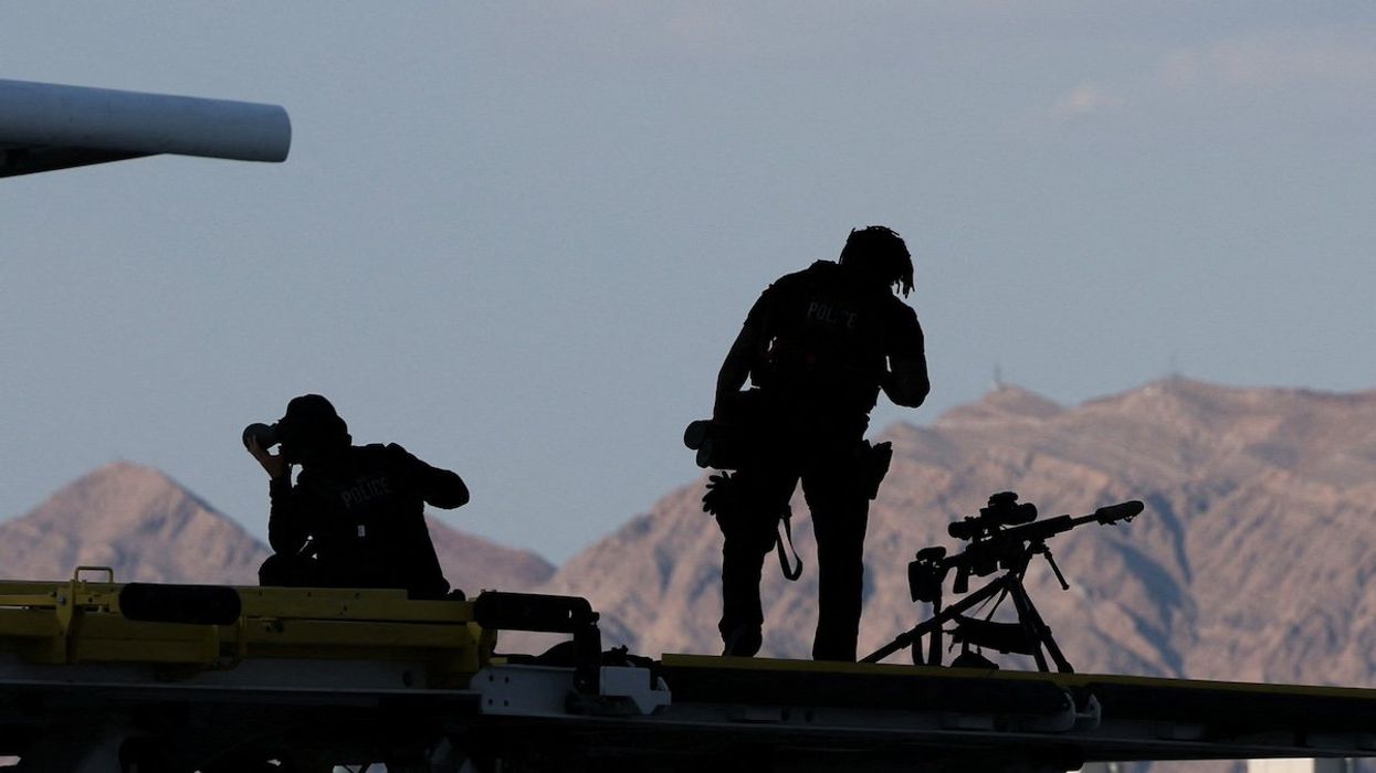 Members of the U.S. Secret Service Counter Sniper team stand guard near Air Force One at Harry Reid International Airport in Las Vegas, Nevada, U.S., July 15, 2024.