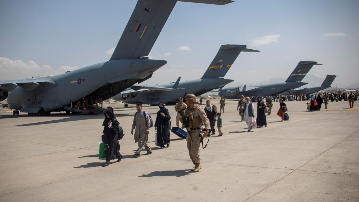 Members of the UK Armed Forces continue to take part in the evacuation of entitled personnel from Kabul airport, in Kabul, Afghanistan August 19-22, 2021, in this handout picture obtained by Reuters on August 23, 2021.