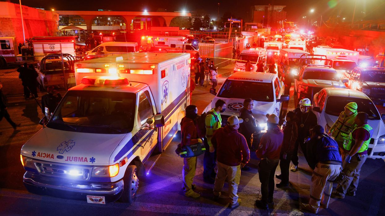 Mexican authorities and firefighters remove injured migrants, mostly Venezuelans, from inside the National Migration Institute (INM) building during a fire, in Ciudad Juarez, Mexico March 27, 2023.