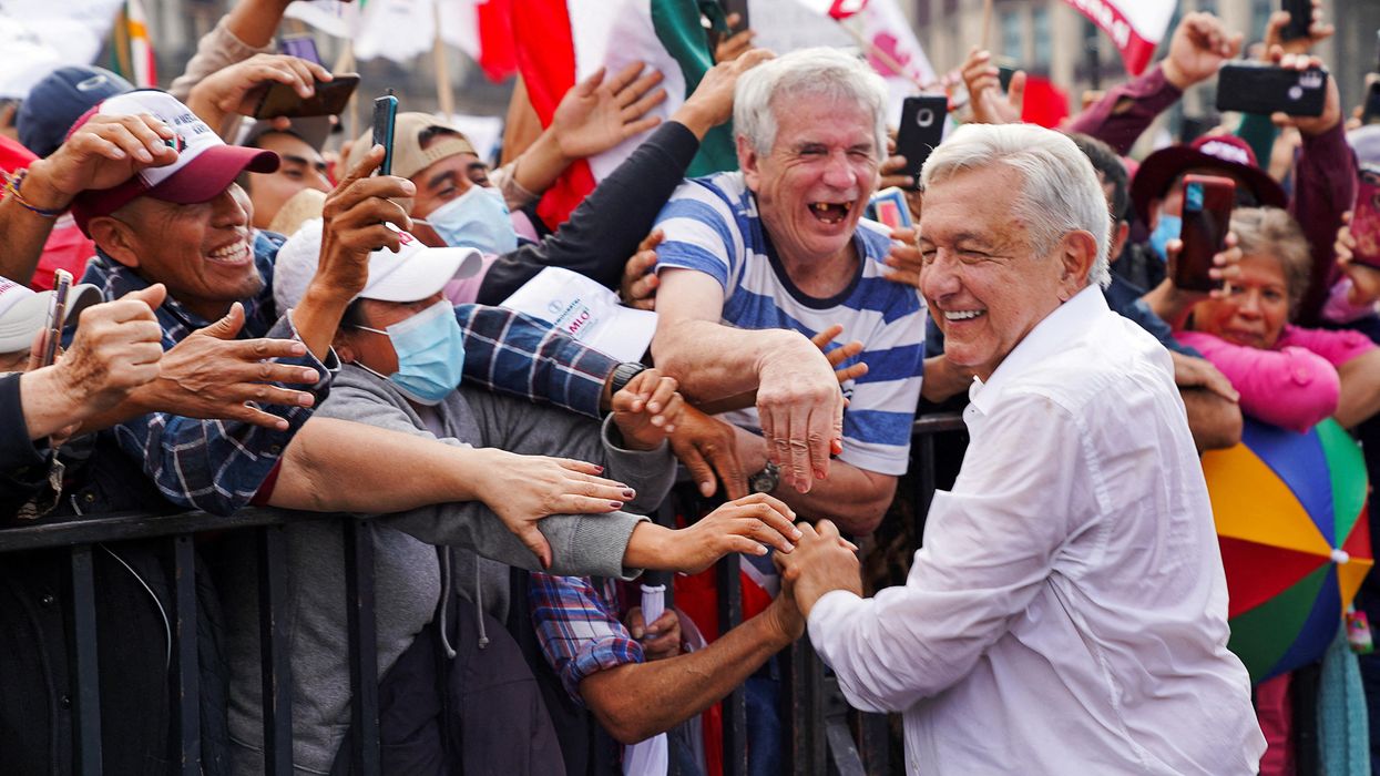 Mexican President Andrés Manuel López Obrador greets supporters after attending a march in support of his government policies in Mexico City.