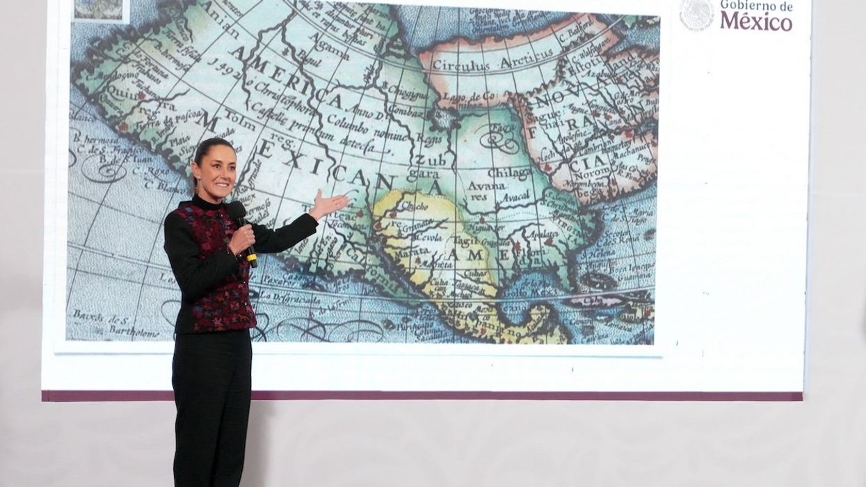 Mexico's President Claudia Sheinbaum shows a 1661 world map showing the Americas and the Gulf of Mexico in response to US President-elect Donald Trump's comments about renaming the body of water, during a press conference at National Palace in Mexico City, Mexico, on Jan. 8, 2025.