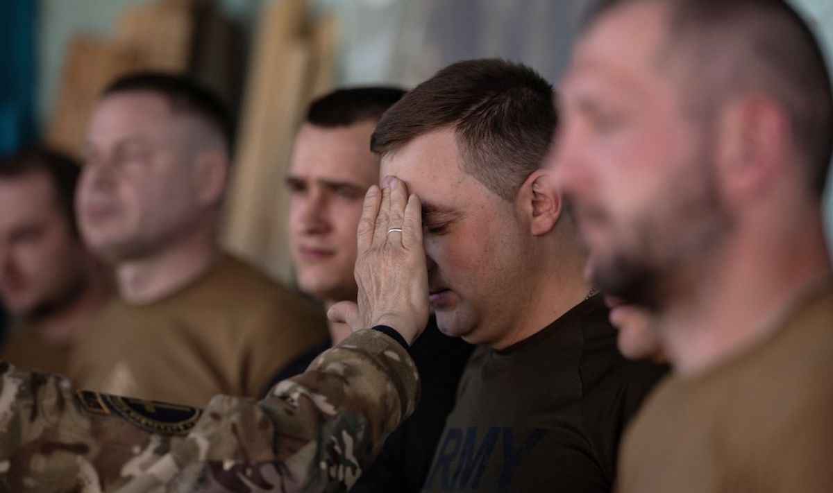 ​Military chaplain conducts Easter service for Ukrainian service members of the "Khartia" 13th Operational Brigade, near a front line, amid Russia's attack on Ukraine, in Kharkiv region, Ukraine on April 20, 2025. 