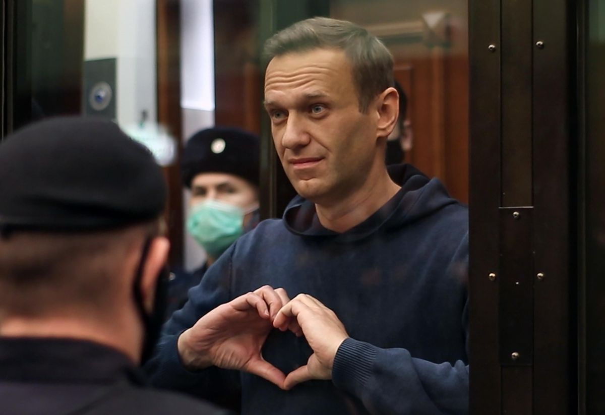 MOSCOW, RUSSIA - FEBRUARY 2, 2021: Russian opposition activist Alexei Navalny makes a heart gesture during a hearing into an application by the Russian Federal Penitentiary Service to convert his suspended sentence of three and a half years in the Yves Rocher case into a real jail term