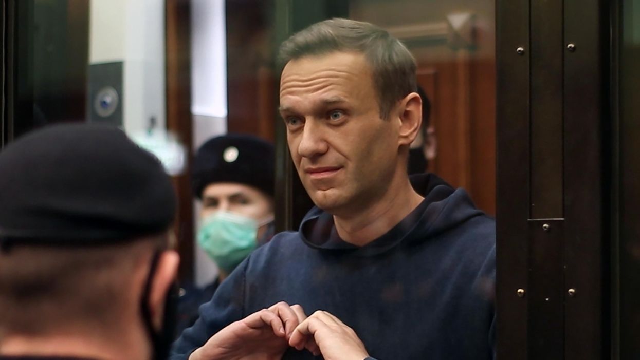 MOSCOW, RUSSIA - FEBRUARY 2, 2021: Russian opposition activist Alexei Navalny makes a heart gesture during a hearing into an application by the Russian Federal Penitentiary Service to convert his suspended sentence of three and a half years in the Yves Rocher case into a real jail term