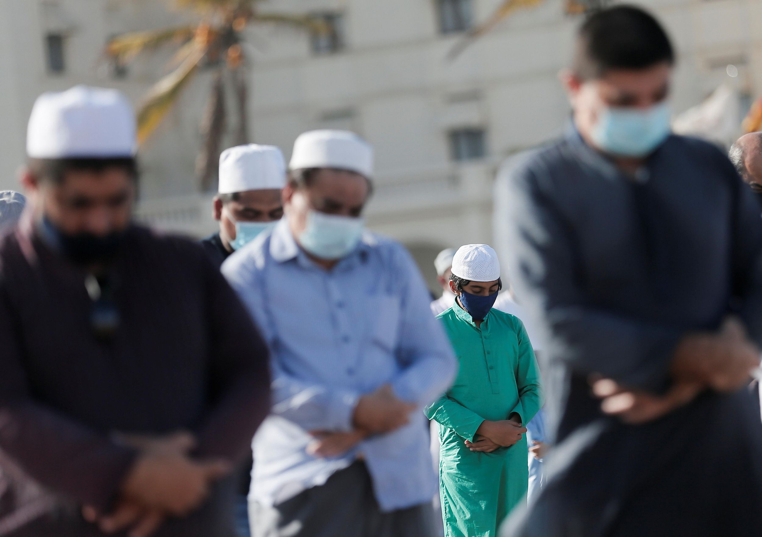 Muslims wearing protective masks practice social distancing as they attend a prayer to mark the Hajj festival, amid concerns about the spread of the coronavirus disease (COVID-19), in Colombo, Sri Lanka, August 1, 2020.