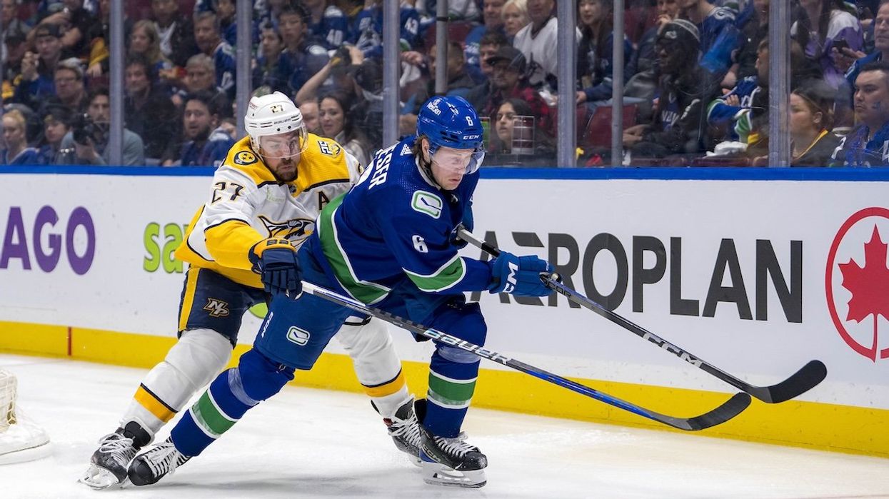 Nashville Predators defenseman Ryan McDonagh (27) stick checks Vancouver Canucks forward Brock Boeser (6) during the third period in game two of the first round of the 2024 Stanley Cup Playoffs at Rogers Arena.