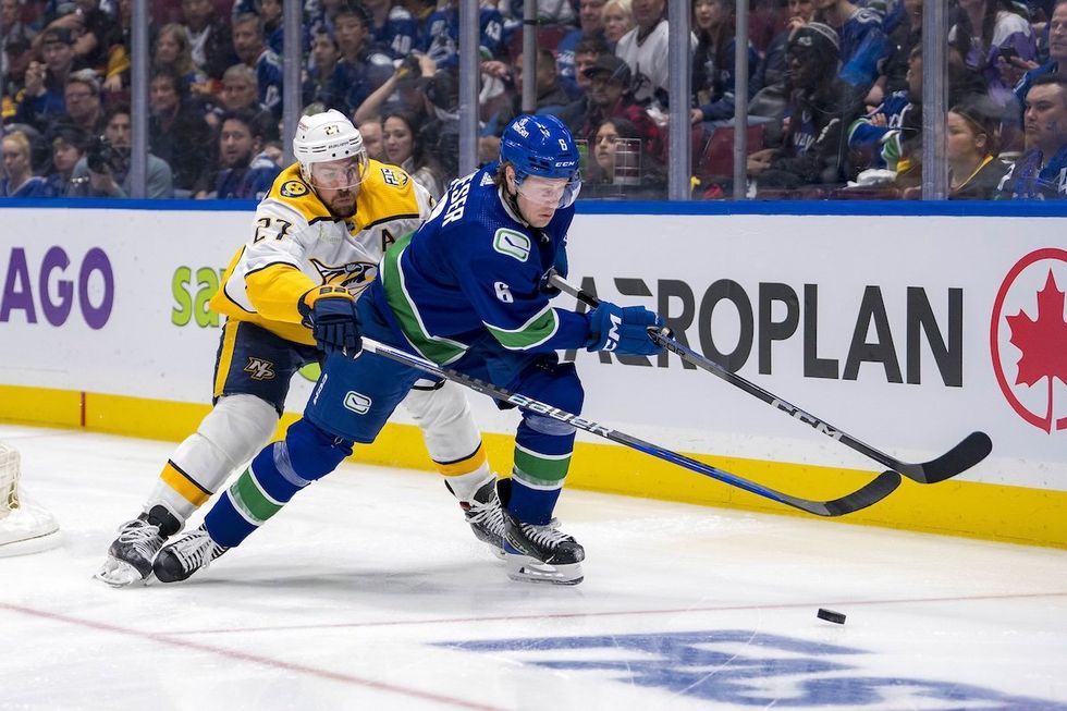 Nashville Predators defenseman Ryan McDonagh (27) stick checks Vancouver Canucks forward Brock Boeser (6) during the third period in game two of the first round of the 2024 Stanley Cup Playoffs at Rogers Arena.