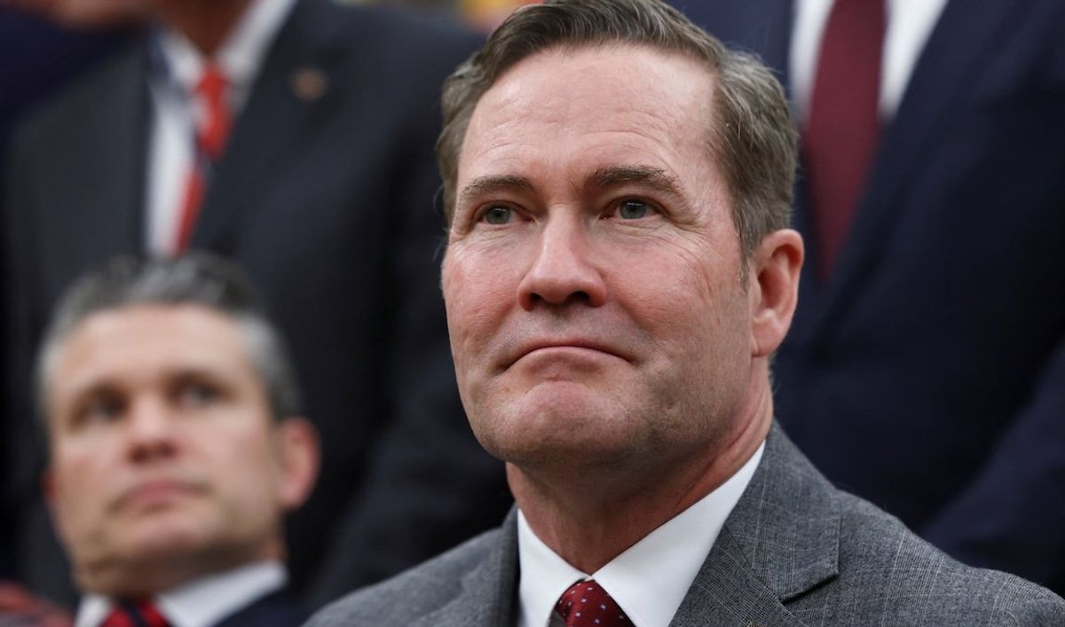 National Security Advisor Mike Waltz looks on as he sits next to US Defense Secretary Pete Hegseth in the Oval Office on March 13, 2025.