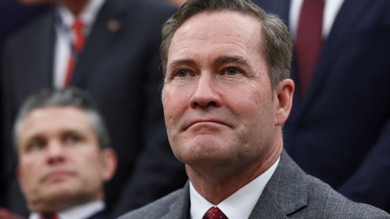 National Security Advisor Mike Waltz looks on as he sits next to US Defense Secretary Pete Hegseth in the Oval Office on March 13, 2025.