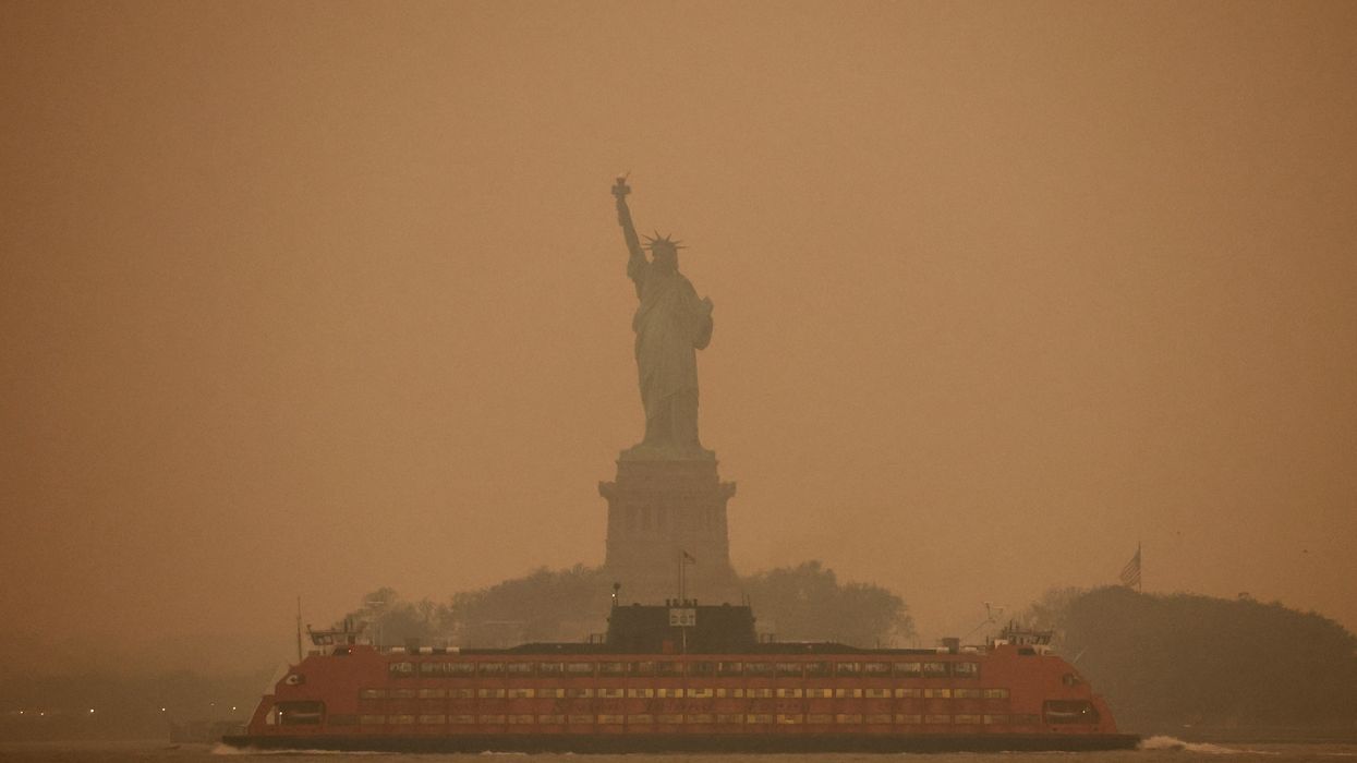 New York City's Statue of Liberty is covered in haze and smoke caused by wildfires in Canada.