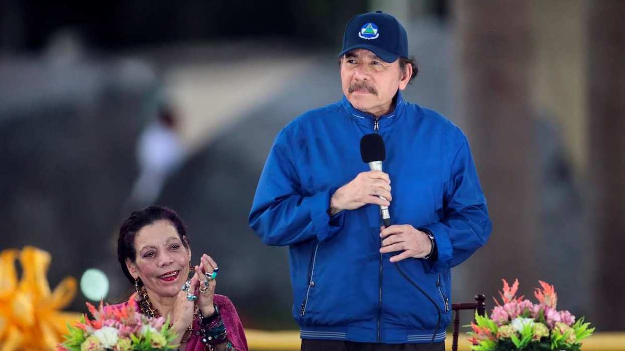 Nicaraguan President Daniel Ortega speaks to supporters with his wife