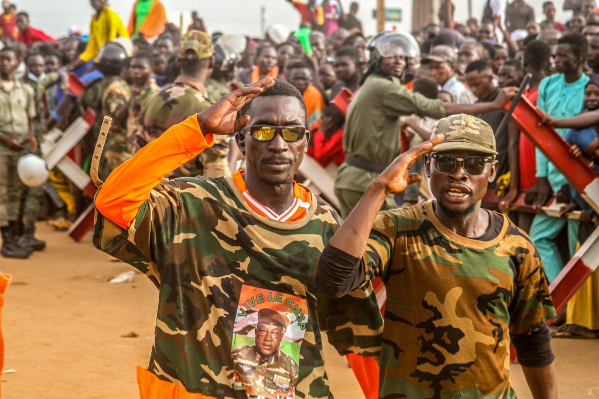 ​Niger's junta supporters take part in a demonstration in front of a French army base in Niamey, Niger, on Aug. 11, 2023. 