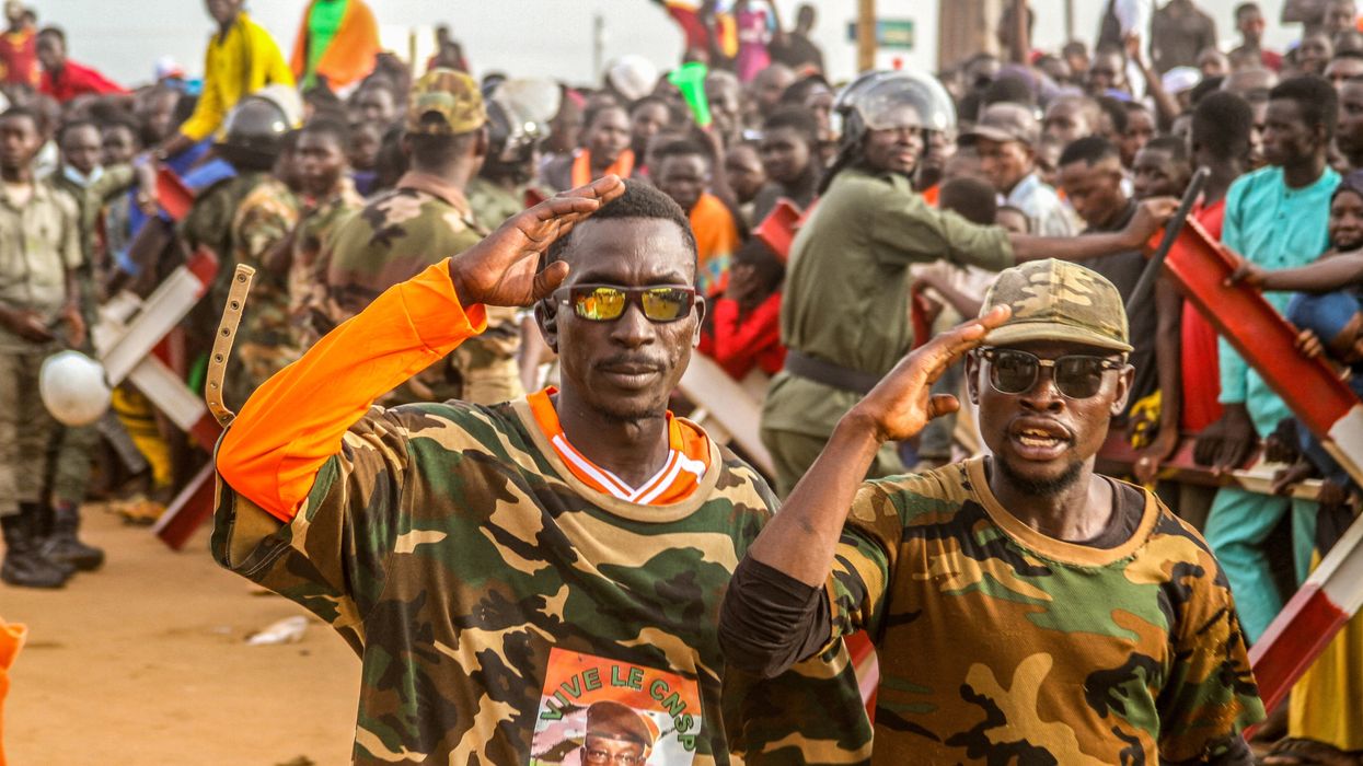 Niger's junta supporters take part in a demonstration in front of a French army base in Niamey, Niger, on Aug. 11, 2023.